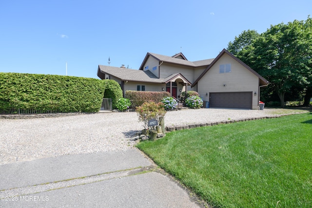 324 Magnolia Ave, Brielle, NJ 08730 - traditional-style house with a garage, a front lawn, and driveway