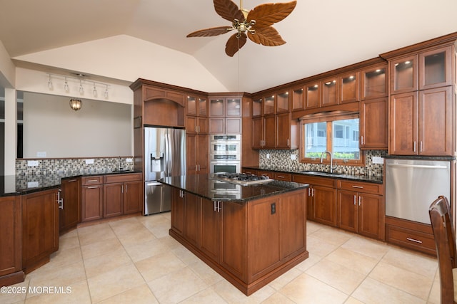 324 Magnolia Ave, Brielle, NJ 08730 - kitchen with appliances with stainless steel finishes, tasteful backsplash, a kitchen island, ceiling fan, and vaulted ceiling