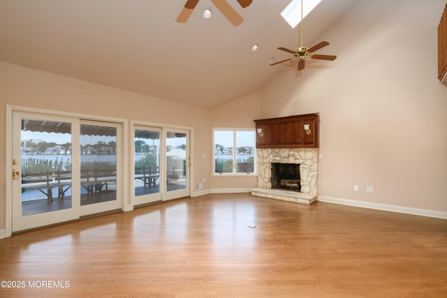 324 Magnolia Ave, Brielle, NJ 08730 - unfurnished living room with ceiling fan, light wood-style floors, high vaulted ceiling, a fireplace, and recessed lighting
