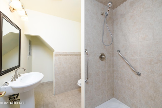 324 Magnolia Ave, Brielle, NJ 08730 - bathroom with a tile shower, tile patterned flooring, and tile walls