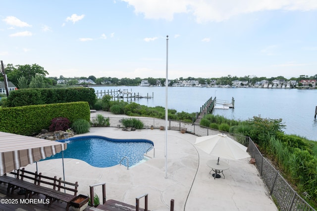324 Magnolia Ave, Brielle, NJ 08730 - view of swimming pool featuring a patio, a water view, and a dock