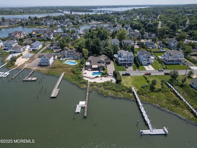 324 Magnolia Ave, Brielle, NJ 08730 - aerial view of residential area featuring a large body of water and a pool area