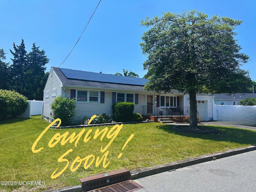202 Nottingham Dr, Brick, NJ 08724 - single story home with solar panels, a garage, driveway, and covered porch
