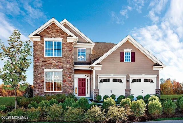 39 Northcrest Dr, Tinton Falls, NJ 07724 - view of front of property with stone siding and a garage