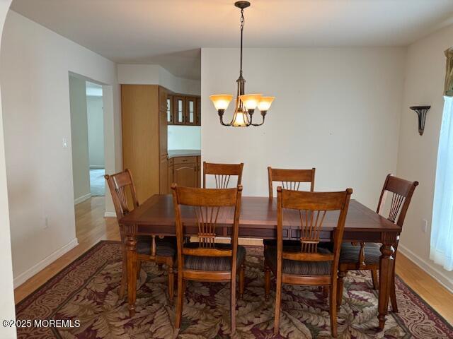184 Pebble Beach Dr, Mays Landing, NJ 08330 - dining area featuring light wood-style flooring and a chandelier