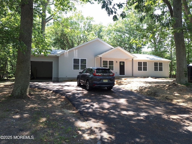 414 Oak Tree Rd, Freehold, NJ 07728 - single story home with driveway and a garage