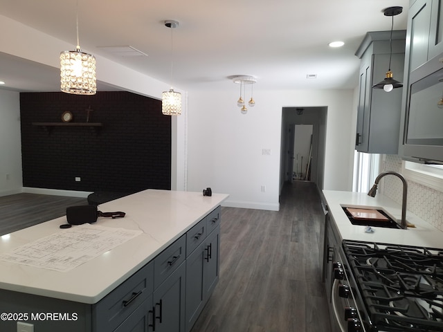 414 Oak Tree Rd, Freehold, NJ 07728 - kitchen featuring gas stove, dark wood finished floors, gray cabinets, a kitchen island, and recessed lighting