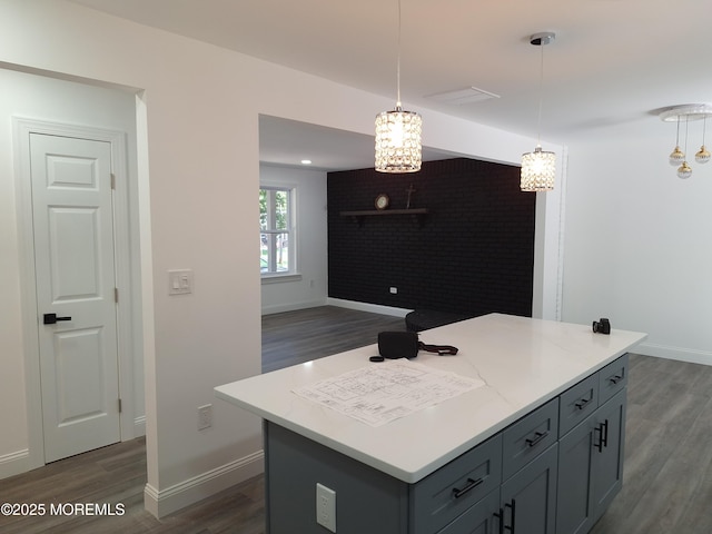 414 Oak Tree Rd, Freehold, NJ 07728 - kitchen with dark wood-style flooring, light countertops, a chandelier, hanging light fixtures, and a kitchen island