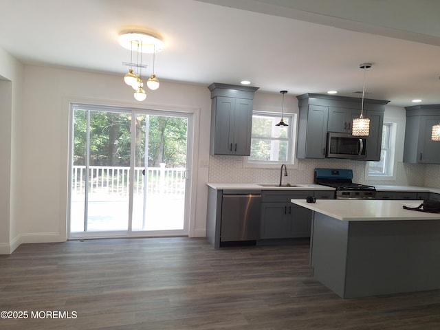 414 Oak Tree Rd, Freehold, NJ 07728 - kitchen with appliances with stainless steel finishes, gray cabinetry, dark wood-style floors, tasteful backsplash, and light countertops