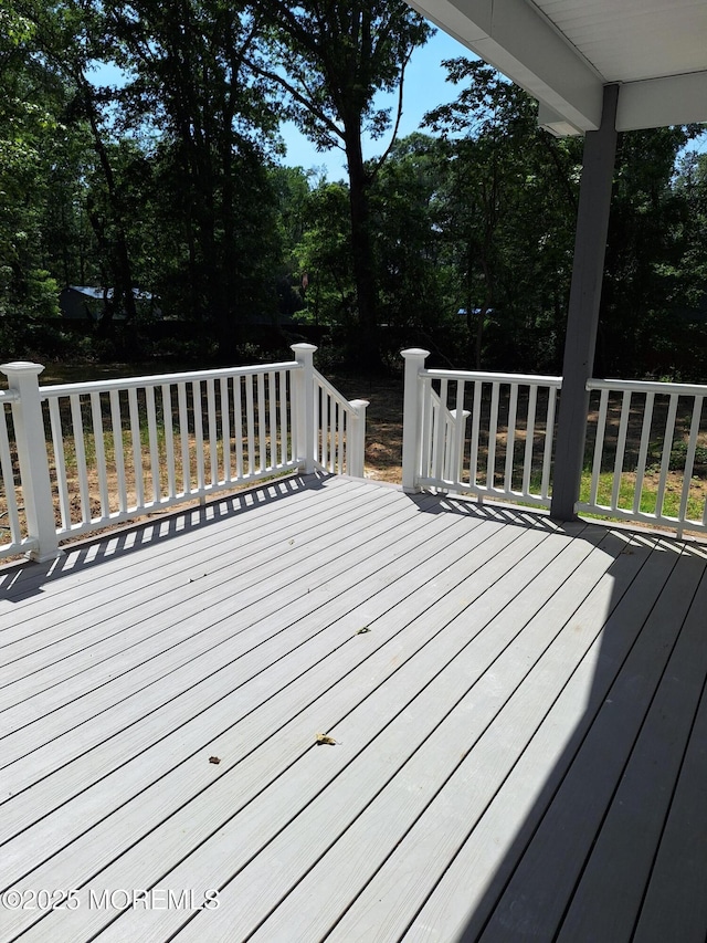 414 Oak Tree Rd, Freehold, NJ 07728 - wooden terrace with view of wooded area