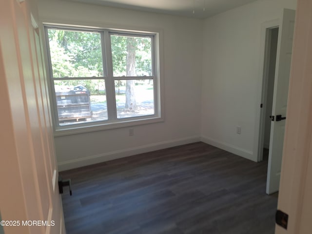 414 Oak Tree Rd, Freehold, NJ 07728 - unfurnished room with plenty of natural light and dark wood-type flooring