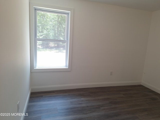 414 Oak Tree Rd, Freehold, NJ 07728 - unfurnished room with dark wood-style flooring