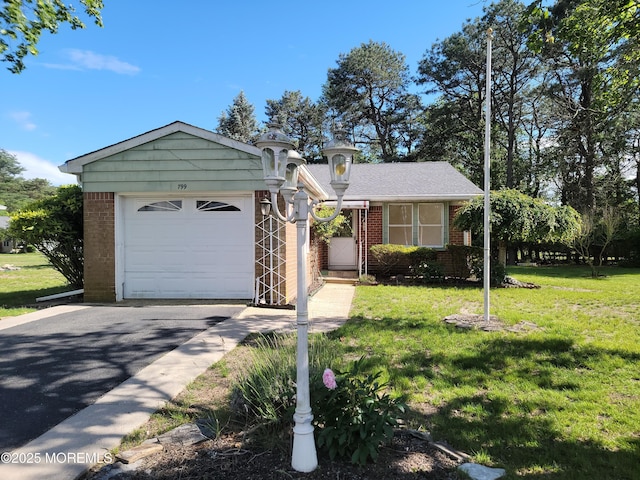 799 Hudson Pkwy, Whiting, NJ 08759 - view of front facade featuring brick siding, driveway, a garage, and a front lawn