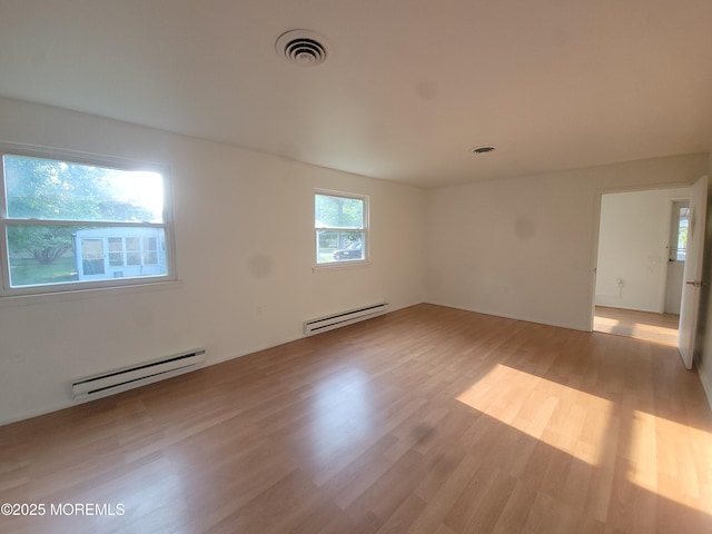 799 Hudson Pkwy, Whiting, NJ 08759 - empty room featuring a baseboard heating unit and light wood finished floors