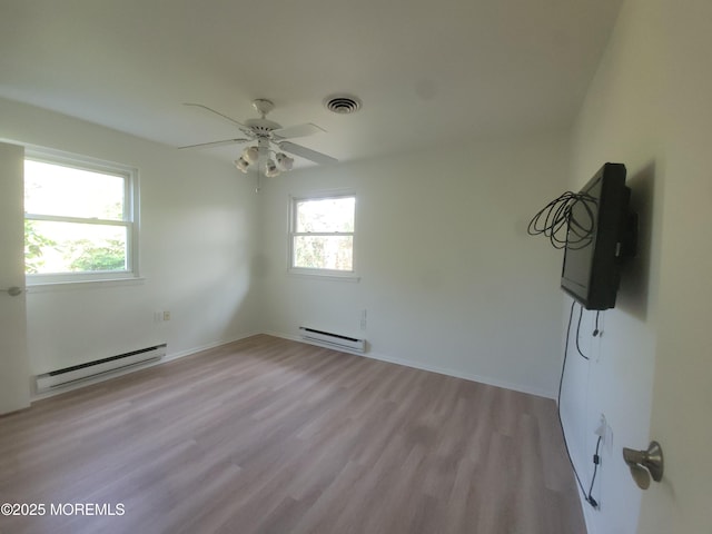 799 Hudson Pkwy, Whiting, NJ 08759 - spare room with a baseboard radiator, wood finished floors, a ceiling fan, and baseboards