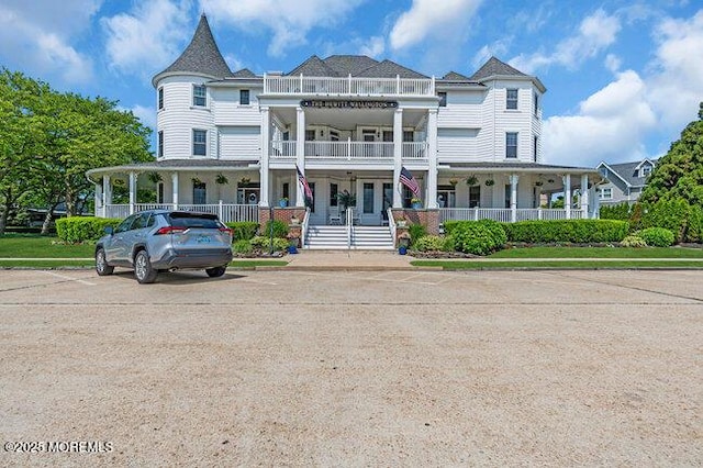 200 Monmouth Ave Unit 7, Spring Lake, NJ 07762 - view of front of property featuring a porch, a balcony, and uncovered parking