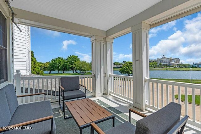 200 Monmouth Ave Unit 7, Spring Lake, NJ 07762 - sunroom / solarium with a water view, an outdoor hangout area, and healthy amount of natural light