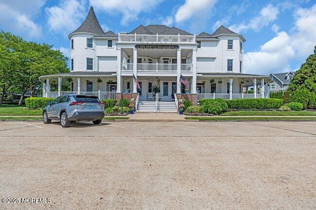 200 Monmouth Ave Unit 7, Spring Lake, NJ 07762 - view of front facade featuring covered porch and a balcony