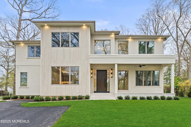 428 Wells Ave, Oakhurst, NJ 07755 - contemporary home featuring a ceiling fan and stucco siding