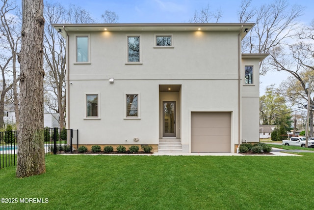 428 Wells Ave, Oakhurst, NJ 07755 - view of front facade featuring stucco siding and an attached garage