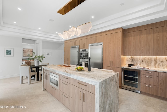 428 Wells Ave, Oakhurst, NJ 07755 - kitchen featuring a raised ceiling, appliances with stainless steel finishes, wine cooler, modern cabinets, and recessed lighting