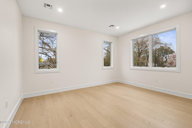 428 Wells Ave, Oakhurst, NJ 07755 - empty room with light wood-style flooring, healthy amount of natural light, baseboards, and recessed lighting