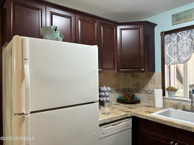 75 Hudson Pkwy Unit C, Whiting, NJ 08759 - kitchen featuring white appliances, dark brown cabinetry, a sink, and tasteful backsplash