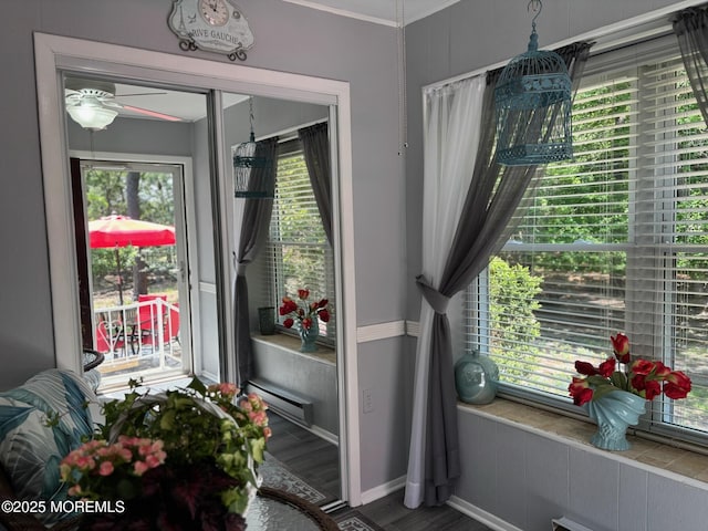 75 Hudson Pkwy Unit C, Whiting, NJ 08759 - entryway featuring a baseboard radiator, plenty of natural light, ceiling fan, wood finished floors, and crown molding