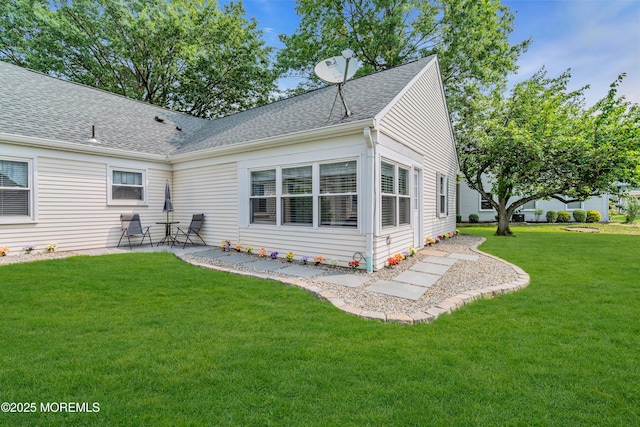 404B Newport Way, Monroe, NJ 08831 - rear view of property with a shingled roof, a patio area, and a lawn