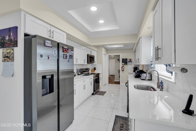 404B Newport Way, Monroe, NJ 08831 - kitchen with stainless steel appliances, backsplash, a raised ceiling, white cabinetry, and recessed lighting