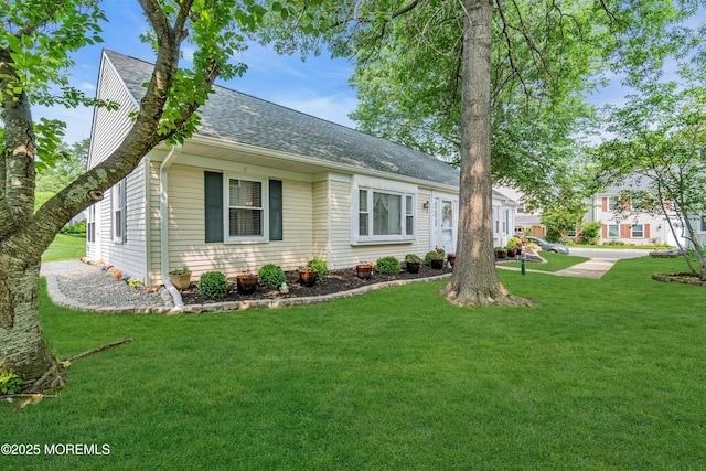 404B Newport Way, Monroe, NJ 08831 - view of front facade with a shingled roof and a front yard