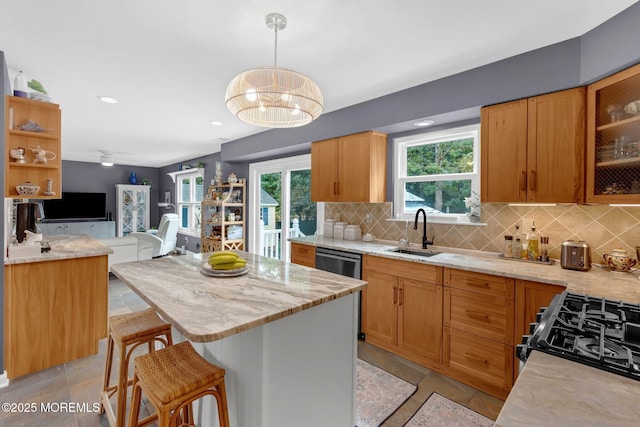 18 Mount Ranier Dr, Howell, NJ 07731 - kitchen with a sink, decorative backsplash, gas range, open floor plan, and pendant lighting