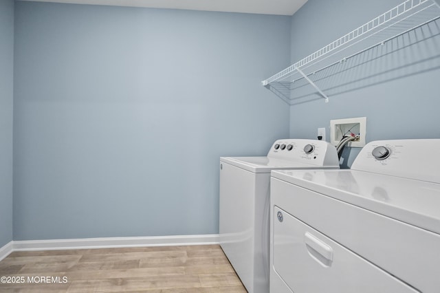1980 Breakers Dr, Barnegat, NJ 08005 - laundry area with washer and clothes dryer, light wood-style flooring, and baseboards