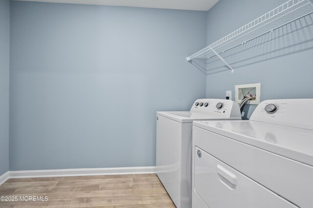 1980 Breakers Dr, Barnegat, NJ 08005 - laundry area with washer and clothes dryer, light wood-style flooring, and baseboards