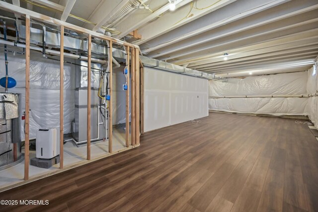 1980 Breakers Dr, Barnegat, NJ 08005 - unfinished basement featuring wood finished floors and heating unit