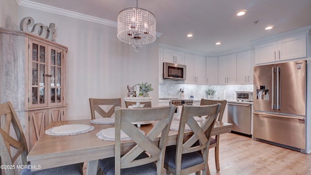 33 Sumner Ave Unit 1A, Seaside Heights, NJ 08751 - dining space featuring crown molding, a chandelier, recessed lighting, and light wood-type flooring