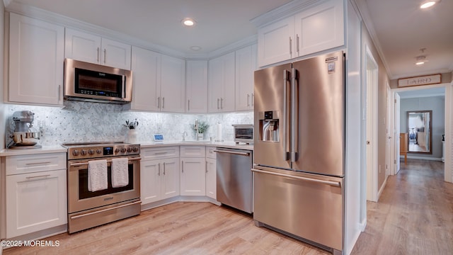 33 Sumner Ave Unit 1A, Seaside Heights, NJ 08751 - kitchen featuring stainless steel appliances, light countertops, white cabinets, and recessed lighting