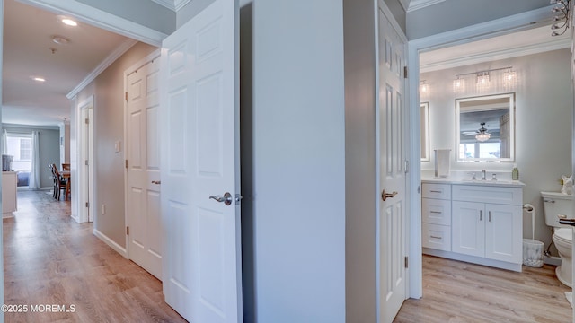 33 Sumner Ave Unit 1A, Seaside Heights, NJ 08751 - corridor featuring crown molding, light wood finished floors, recessed lighting, and a sink