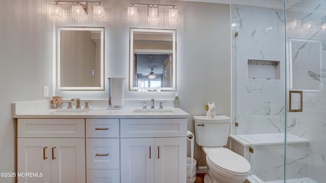 33 Sumner Ave Unit 1A, Seaside Heights, NJ 08751 - full bath featuring double vanity, toilet, a marble finish shower, and a ceiling fan