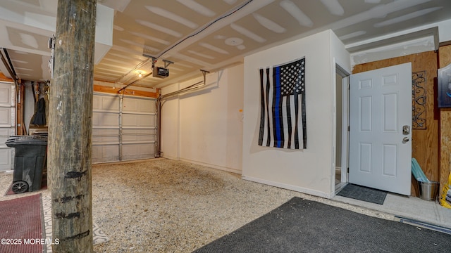 33 Sumner Ave Unit 1A, Seaside Heights, NJ 08751 - garage with a garage door opener and baseboards
