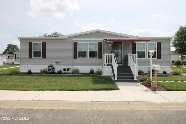 610 Jerome Pl, Freehold, NJ 07728 - manufactured / mobile home featuring a front yard