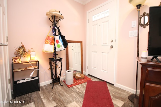 610 Jerome Pl, Freehold, NJ 07728 - foyer featuring wood finished floors and ornamental molding