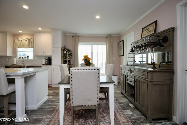 610 Jerome Pl, Freehold, NJ 07728 - dining area with crown molding, recessed lighting, dark wood-style floors, and bar area