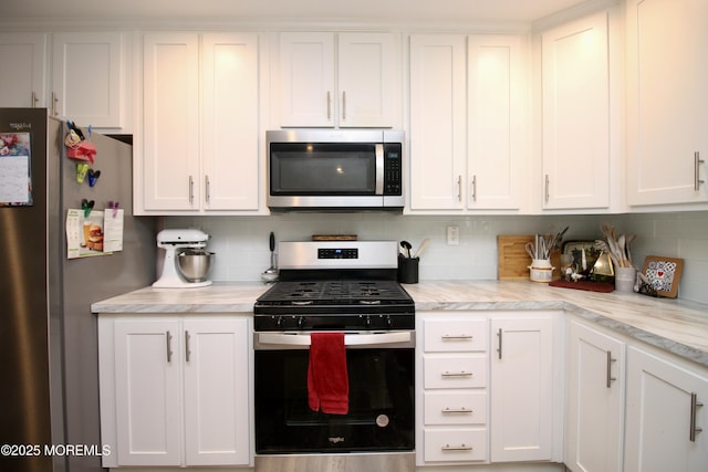 610 Jerome Pl, Freehold, NJ 07728 - kitchen featuring appliances with stainless steel finishes, white cabinetry, and light countertops