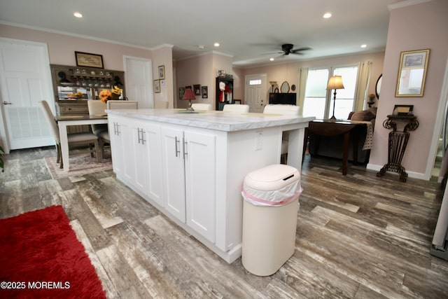 610 Jerome Pl, Freehold, NJ 07728 - kitchen with crown molding, white cabinets, wood finished floors, a center island, and light countertops