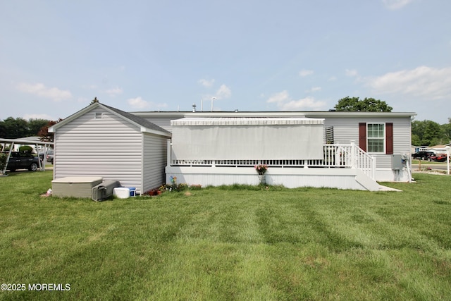 610 Jerome Pl, Freehold, NJ 07728 - back of property featuring a lawn and a deck