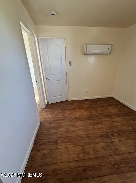 3 Oceanview Ave, Keansburg, NJ 07734 - spare room with a wall mounted air conditioner, dark wood-type flooring, baseboards, and a smoke detector
