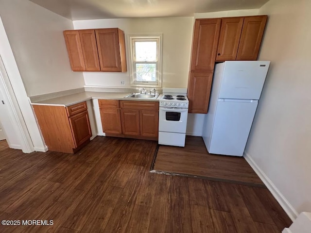 3 Oceanview Ave, Keansburg, NJ 07734 - kitchen with white appliances, a sink, dark wood-style floors, light countertops, and brown cabinets
