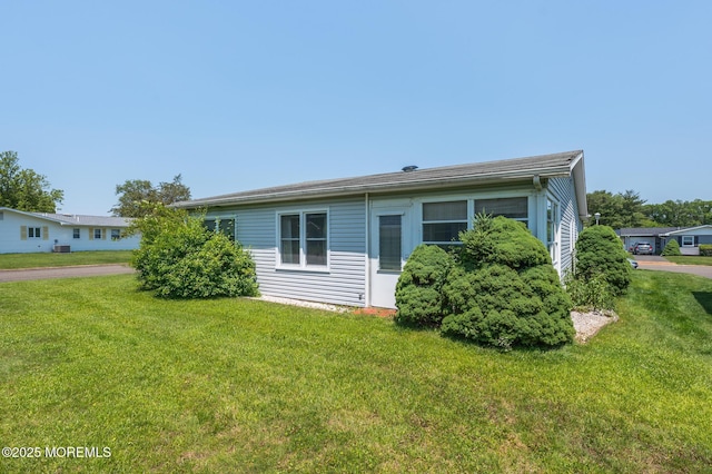 19 Clay Cir, Brick, NJ 08724 - view of side of home featuring a yard