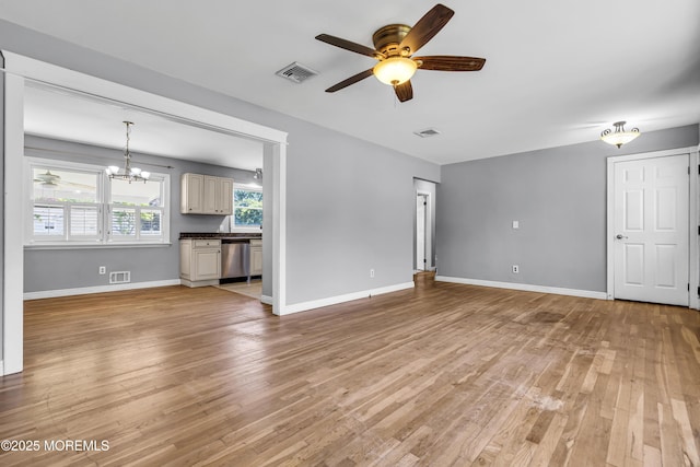 55 S Ave, Bayville, NJ 08721 - unfurnished living room featuring a ceiling fan, light wood-style floors, a chandelier, and baseboards